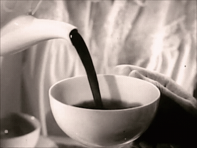 A Black And White Photo Of A Person Pouring A Cup Of Coffee GIF