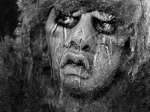 A Black And White Photo Of A Person 'S Face GIF