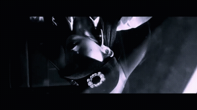 A Black And White Photo Of A Person 'S Face With A Purple Background GIF