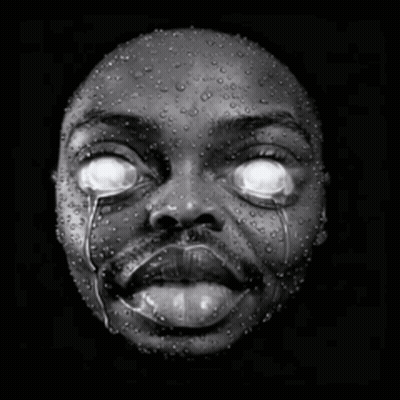 A Black And White Photo Of A Person 'S Face With Water Drops On It GIF