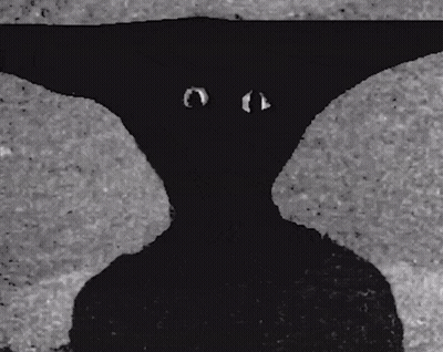 A Black And White Photo Of A Person 'S Shadow GIF