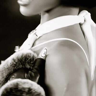 A Black And White Photo Of A Person 'S Shoulder GIF