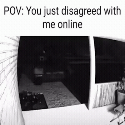 A Black And White Photo Of A Person Standing In Front Of A Door . GIF