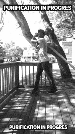 A Black And White Photo Of A Person Standing Under A Tree With The Words Purification In Progress Above Them GIF