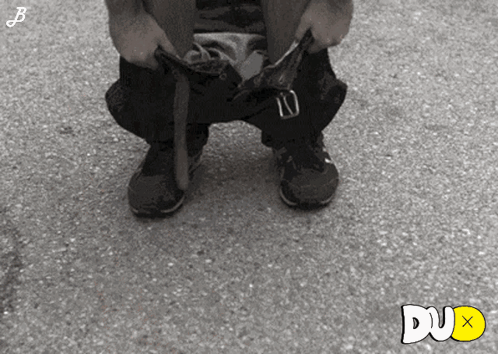 Black And White Photo Of Person Taking Off Pants Dux Text GIF