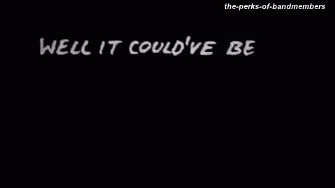 A Black And White Photo Of A Person Walking In The Dark GIF