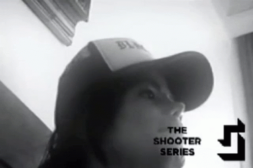 A Black And White Photo Of A Person Wearing A Hat With The Words The Shooter Series On The Bottom Right GIF