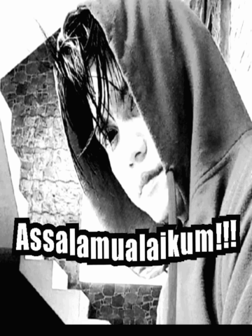 A Black And White Photo Of A Person Wearing A Hoodie That Says Assalamualaikum !! GIF