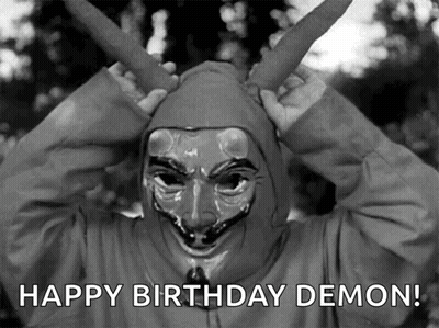 A Black And White Photo Of A Person Wearing A Mask With The Words Happy Birthday Demon Below It GIF
