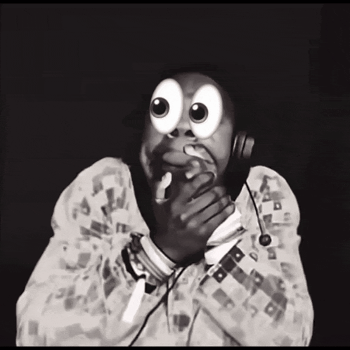A Black And White Photo Of A Person Wearing Headphones With Big Googly Eyes GIF
