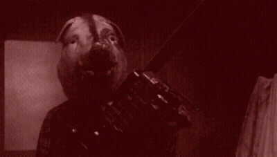 A Black And White Photo Of A Person With A Pig Head . GIF