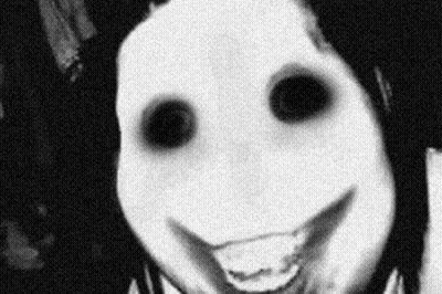 A Black And White Photo Of A Person With A Scary Face And Black Eyes Smiling . GIF