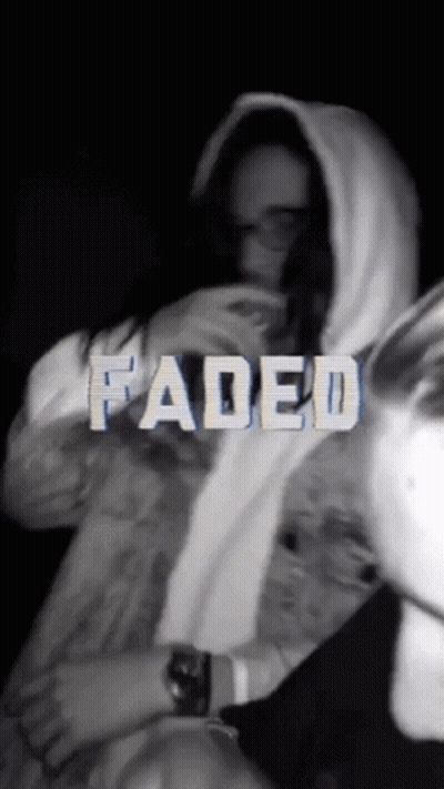A Black And White Photo Of A Person With Faded Written In White Letters GIF