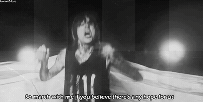 A Black And White Photo Of A Person With The Words So March With Me If You Believe There 'S Any Hope For Us Below Them GIF