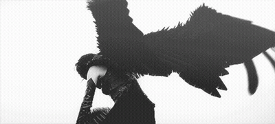 A Black And White Photo Of A Person With Wings And Smoke Coming Out Of Their Head . GIF