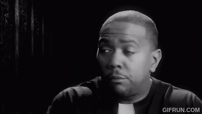 A Black And White Photo Of A Priest Making A Face GIF