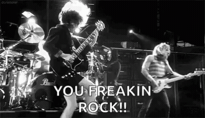 A Black And White Photo Of A Rock Band With The Words You Freakin Rock Written In The Corner GIF