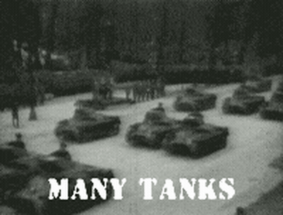 A Black And White Photo Of A Row Of Tanks With The Caption Many Tanks GIF