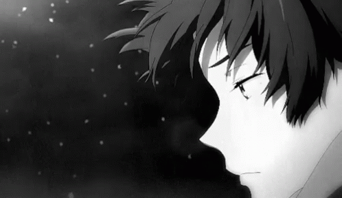 A Black And White Photo Of A Sad Anime Boy With His Eyes Closed In The Snow . GIF