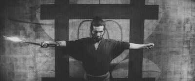 A Black And White Photo Of A Samurai Holding A Sword . GIF