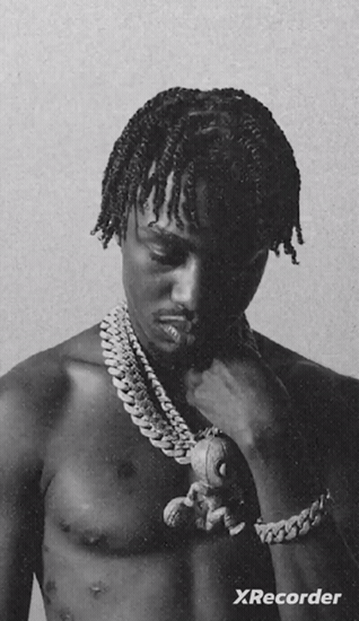 A Black And White Photo Of A Shirtless Man Holding A Teddy Bear With Xrecorder Written On The Bottom GIF