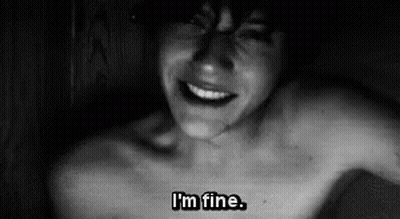 A Black And White Photo Of A Shirtless Man With The Words `` I 'M Fine '' Written On His Chest . GIF