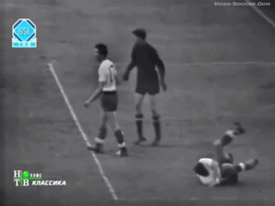 A Black And White Photo Of A Soccer Game From The Year 1950 GIF