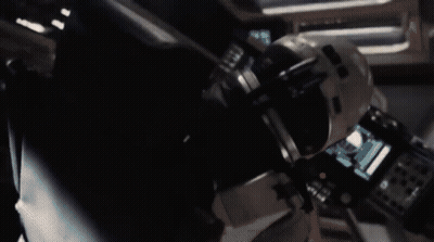 A Black And White Photo Of A Space Ship With A Star In The Middle GIF