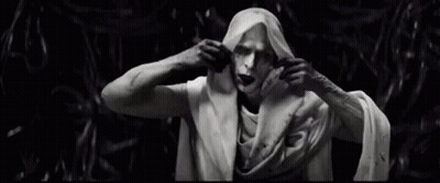 A Black And White Photo Of A Statue Of A Man Wrapped In A Cloth . GIF