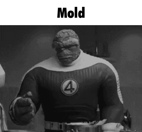 A Black And White Photo Of A Superhero With The Word Mold Written On It . GIF