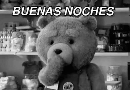 A Black And White Photo Of A Teddy Bear With A Help Badge On Its Chest . GIF