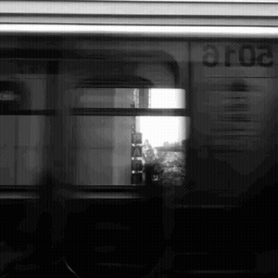 A Black And White Photo Of A Train With The Number Aro2 On The Side GIF