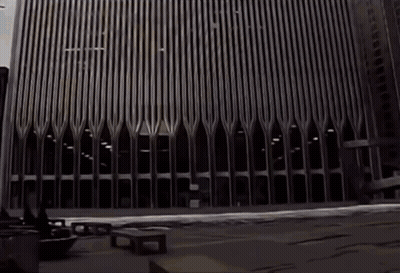 A Black And White Photo Of A Very Tall Building With The Letters Ec On It GIF