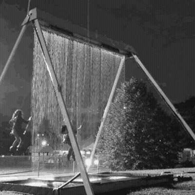 A Black And White Photo Of A Water Curtain GIF