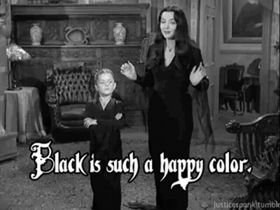 A Black And White Photo Of A Woman And A Boy Standing In A Living Room . GIF