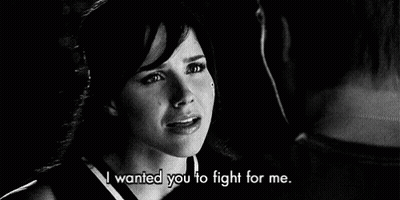 A Black And White Photo Of A Woman Crying Next To A Man . GIF