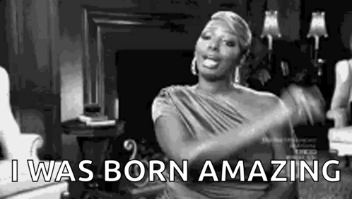 A Black And White Photo Of A Woman Dancing In A Living Room While Saying `` I Was Born Amazing '' . GIF
