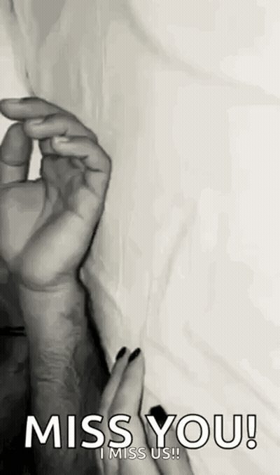 A Black And White Photo Of A Woman Holding A Man 'S Hand With The Words `` Miss You ! '' GIF