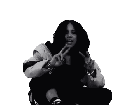 A Black And White Photo Of A Woman In A White Jacket Giving A Peace Sign Sticker