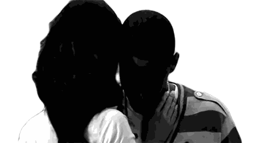 A Black And White Photo Of A Woman Kissing A Man On The Cheek Sticker