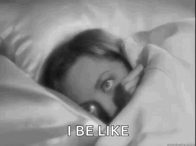 A Black And White Photo Of A Woman Laying In Bed With The Words I Be Like . GIF