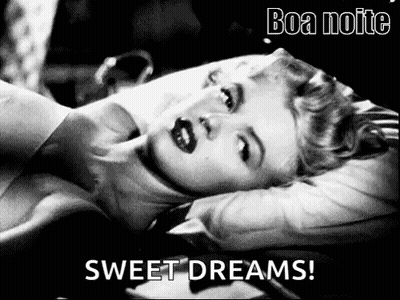 A Black And White Photo Of A Woman Laying On A Bed With The Words `` Sweet Dreams '' Written On The Bottom . GIF