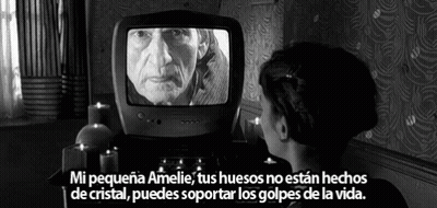 A Black And White Photo Of A Woman Looking At An Old Man On A Tv GIF