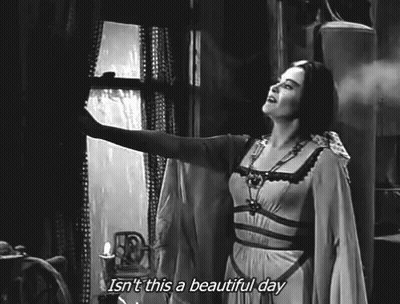 A Black And White Photo Of A Woman Looking Out A Window With The Caption Isn 'T This A Beautiful Day . GIF