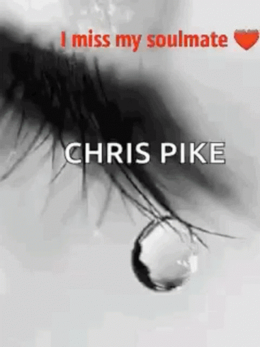A Black And White Photo Of A Woman 'S Eye With A Tear Drop . GIF