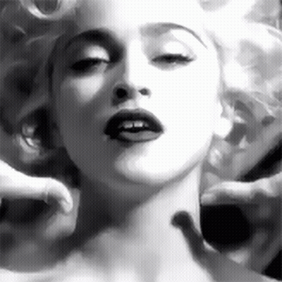 A Black And White Photo Of A Woman 'S Face With A Man 'S Hands On Her Neck . GIF