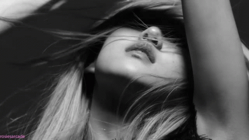 A Black And White Photo Of A Woman 'S Face With The Hashtag Rosiesarcade GIF