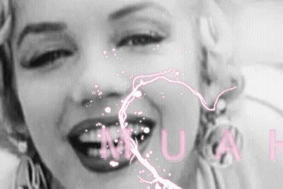 A Black And White Photo Of A Woman 'S Face With The Word Muse Written In Pink GIF