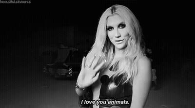 A Black And White Photo Of A Woman Saying `` I Love You Animals '' . GIF