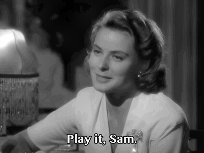 A Black And White Photo Of A Woman Saying " Play It, Sam " GIF
